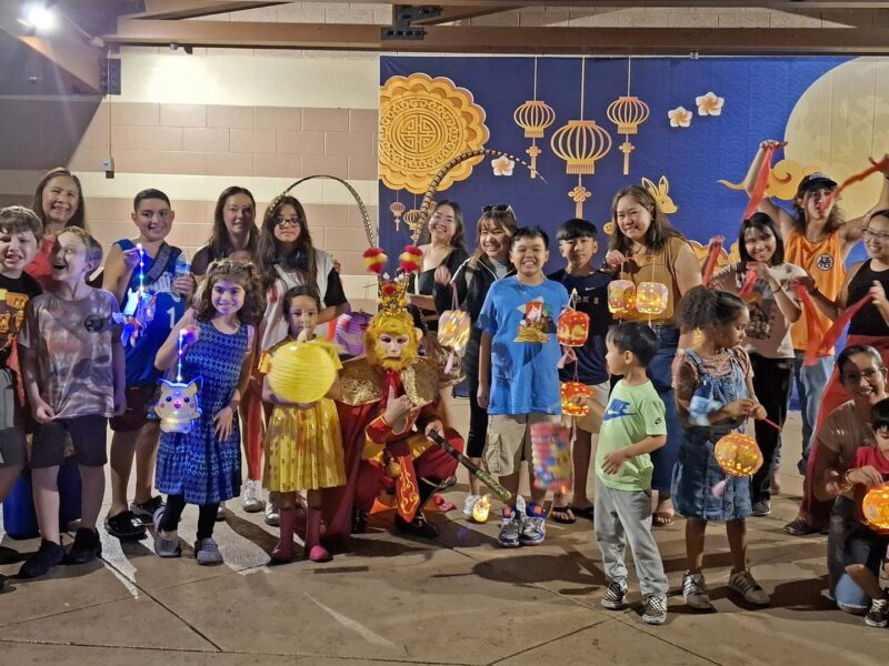 Moon Over Avalon Mid-Autumn Festival night market — families with lanterns at Avalon Park.