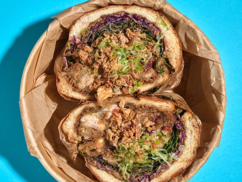 Mae Tao OG sandwich in a parchment takeout bowl
