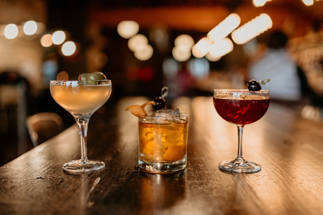 Craft cocktails served at a dimly lit bar