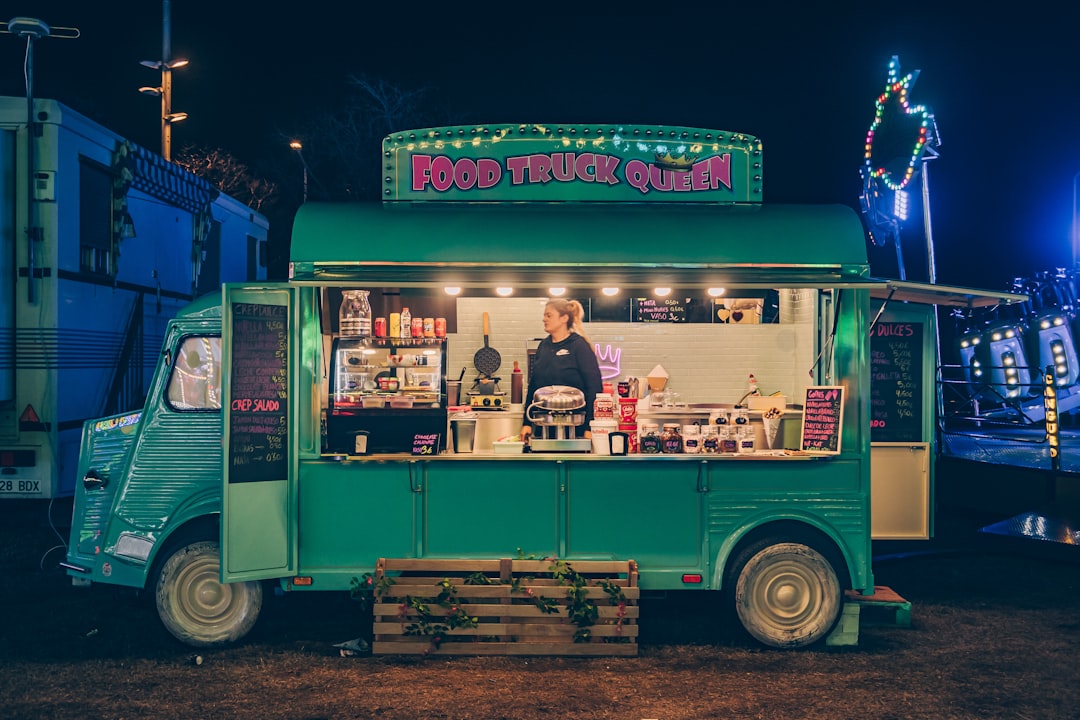 Food trucks lit up at night for Food Truck Friday